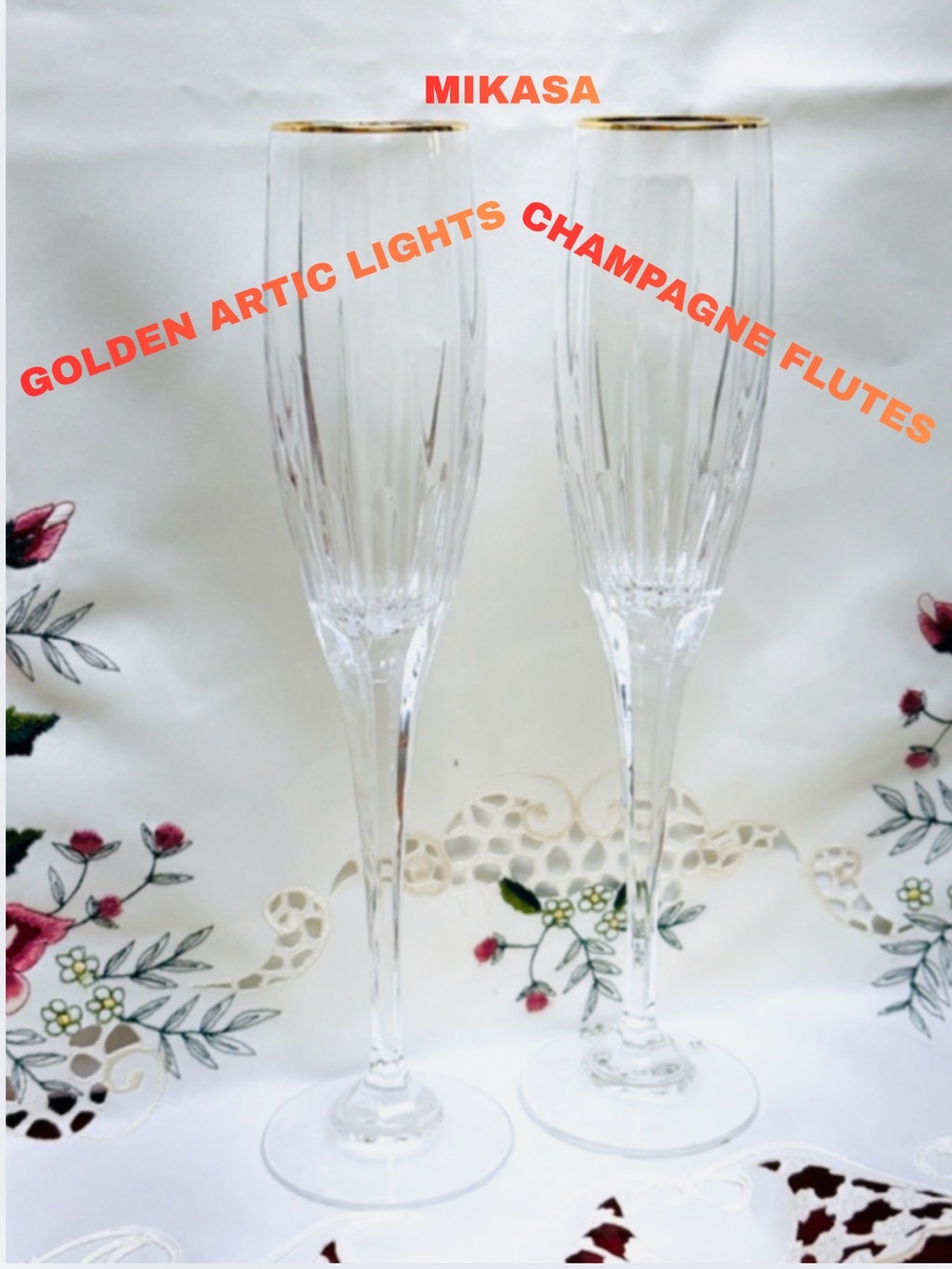 SET OF 2 MIKASA HAND BLOWN LEAD CRYSTAL GOLDEN ARTIC LIGHTS CHAMPAGNE FLUTES.
